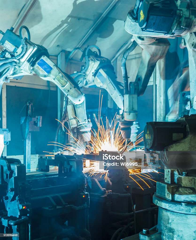 Welding robots Welding robots movement in a car factory Industry Stock Photo