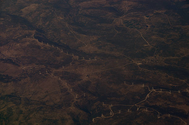 istock many wind turbines from airplane 513598314