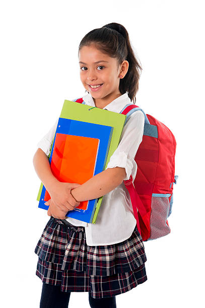 かわいい小さなスクールガール用のバックパックや書籍笑顔 schoolbag - school supplies child back to school book ストックフォトと画像