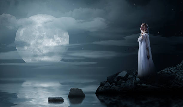 istock Elven girl at night sea shore 513601208