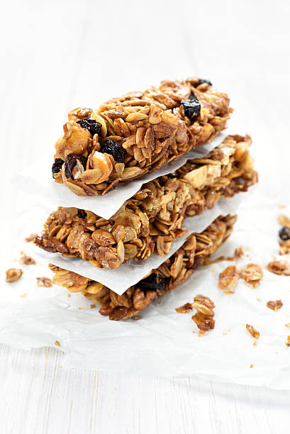 istock Granola bars on white wooden table 513601432