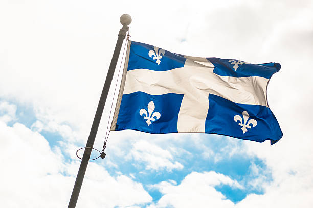 istock quebec flag waving on the sky 513601959