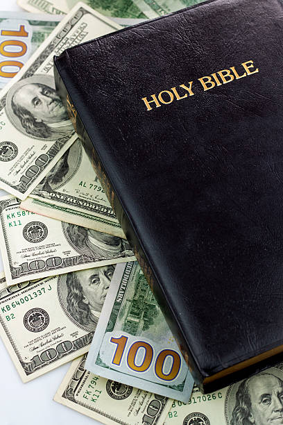 istock Holy Bible and money 513602659