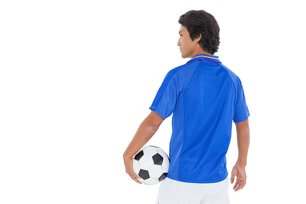 istock Serious football player over white background 513602807