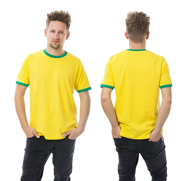 istock Man posing with blank yellow and green shirt 513602827