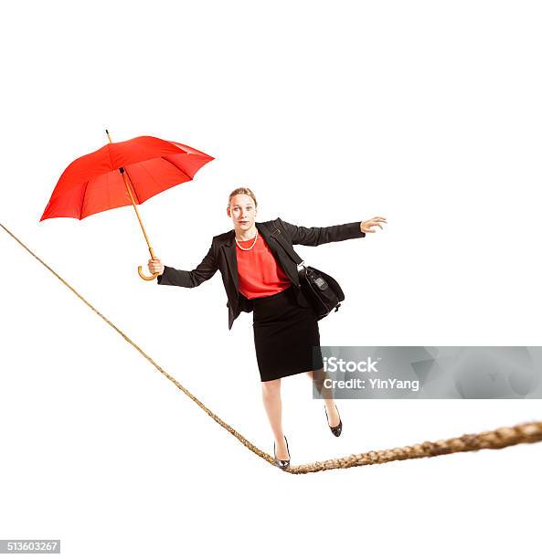 Business Woman Balancing Worklife Tightrope On White Background Stock Photo - Download Image Now