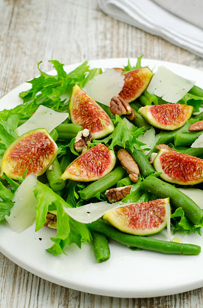 Salad with figs and needle beans stock photo