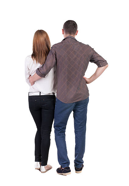 istock Back view of young embracing couple 513603455