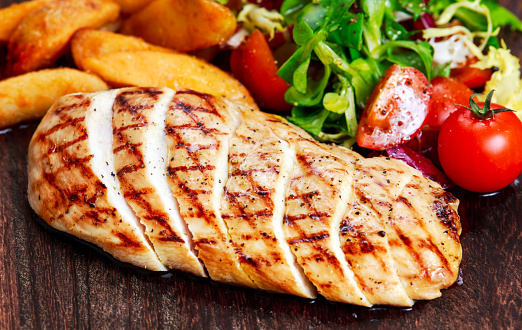 Grilled Chicken breast. with potato and vegetables.