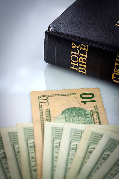 istock Holy Bible and money 513605487