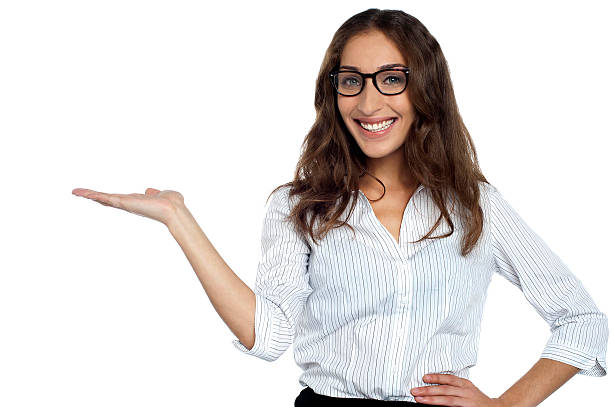 istock Joyous woman in spectacles posing with open palm 513608081