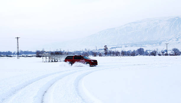 istock SUV driving on snow-covered glacier 513623300