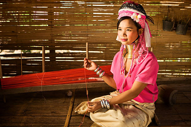 Portrait of Woman from Long Neck Karen Tribe Portrait of a long-neck woman Padaung (Karen) tribe, Mae Hong Son Province in Northern Thailand. padaung tribe stock pictures, royalty-free photos & images