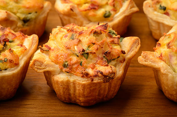 istock Tartlets baked with mashed potato, cheese, ham and parsley. 513625198