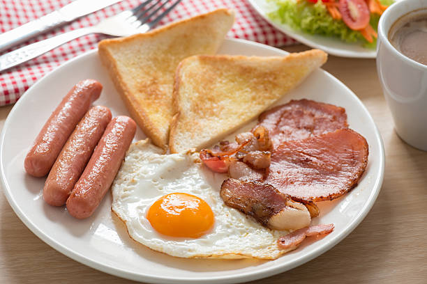 istock English breakfast with coffee on wood table. 513625698