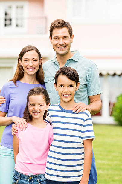 istock Happy Two Generation Family In Front Garden 513628943