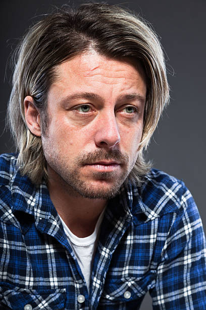 istock Expressive young man with blond long hair and beard. 513629325