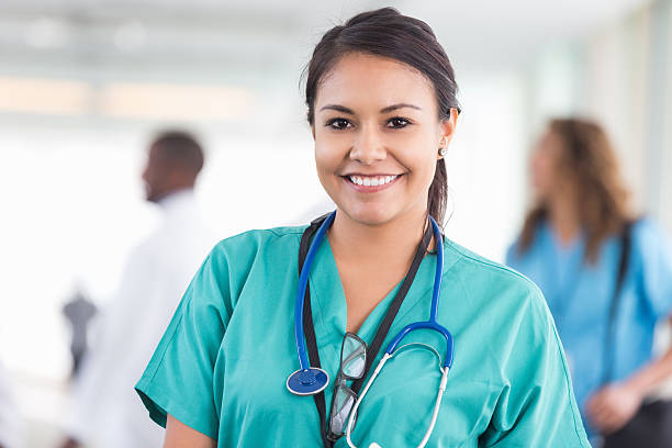 istock Friendly beautiful nurse smiling during shift at hospital 513629353