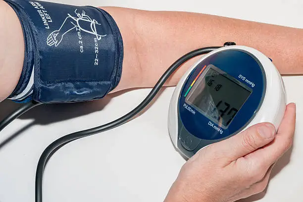 Sphygmomanometer measuring blood pressure on an arm