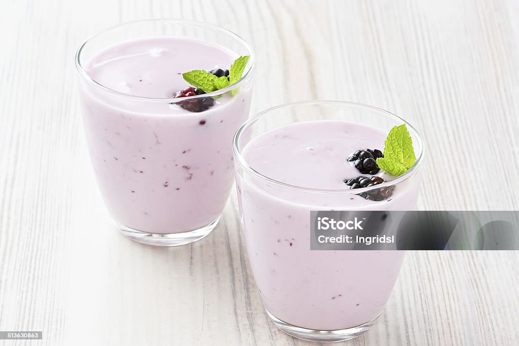 Yogurt with sweet dewberry Fresh yogurt with sweet dewberry for healthy breakfast Yogurt Stock Photo