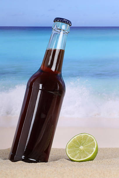 istock Cola soda drink on the beach 513632213