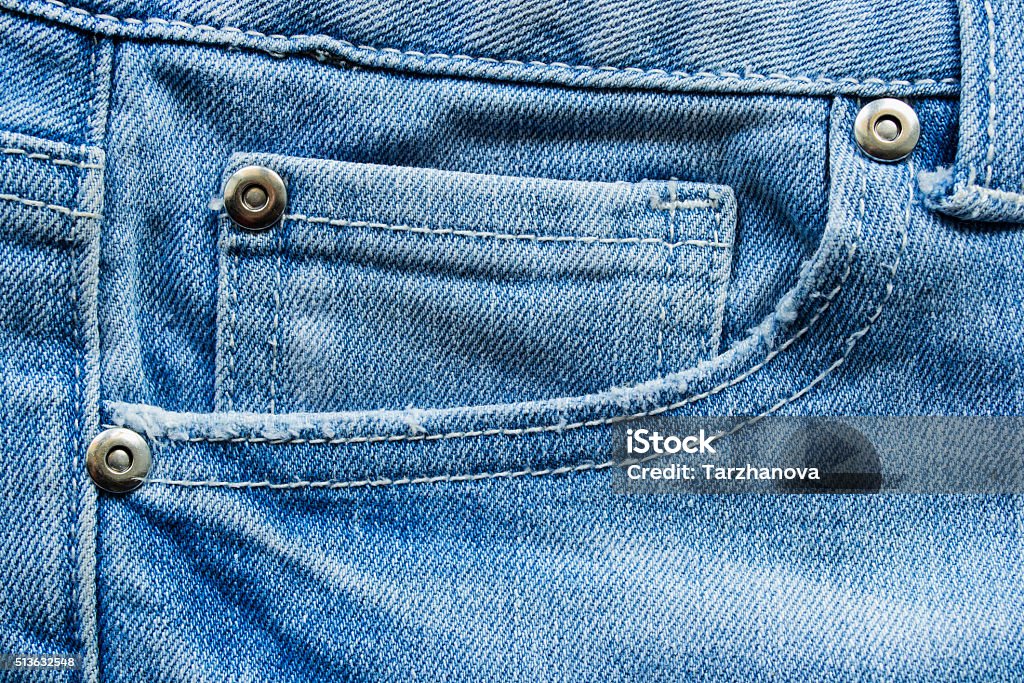 Jeans pocket Jeans front pocket with metal rivets as a background Jeans Stock Photo