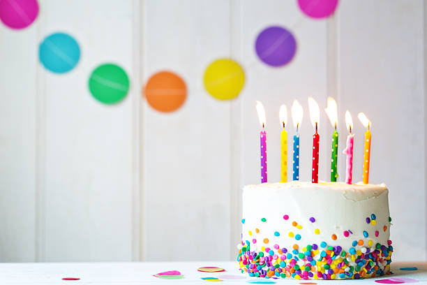 Birthday cake Birthday cake with colorful candles streamer photos stock pictures, royalty-free photos & images