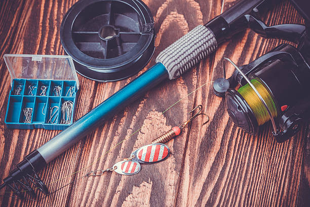istock fishing tackle on a wooden table 513632939