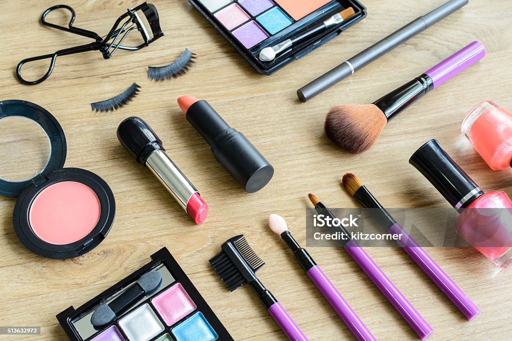 make up with cosmetics and brushes make up with cosmetics and brushes on wooden table Adult Stock Photo