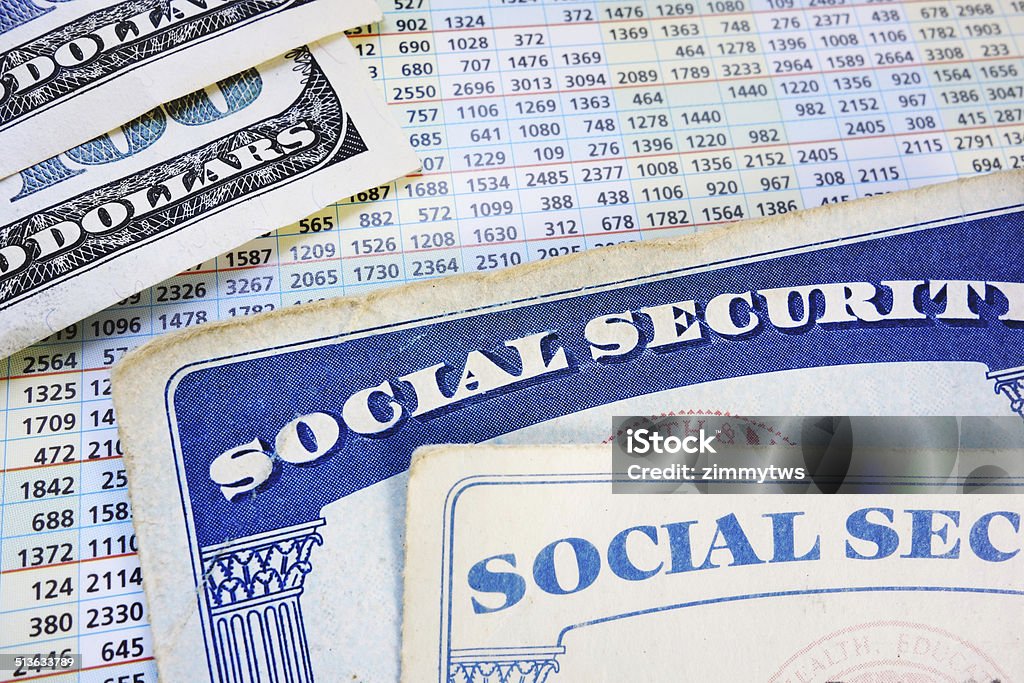 retirement benefits Social Security cards with cash and benefit amount numbers Social Security Stock Photo