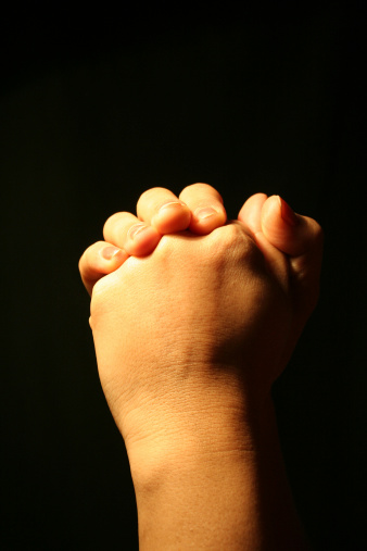 Hands folded in prayer