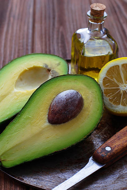 istock Fresh avocado on wooden  background 513635490