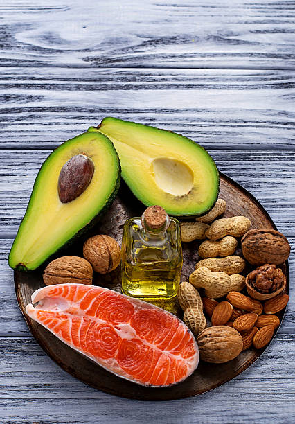 istock Healthy fat salmon, avocado, oil, nuts 513636232