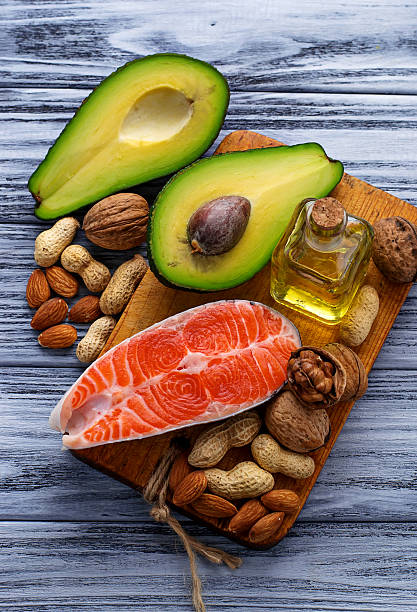 istock Healthy fat salmon, avocado, oil, nuts 513636318