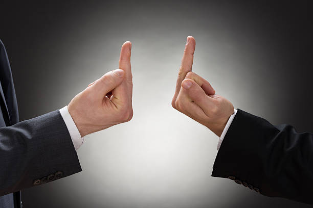 istock Two Businessman Showing Fuck Sign 513636600