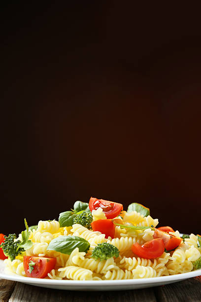 istock Delicious pasta on plate on grey wooden background 513638894