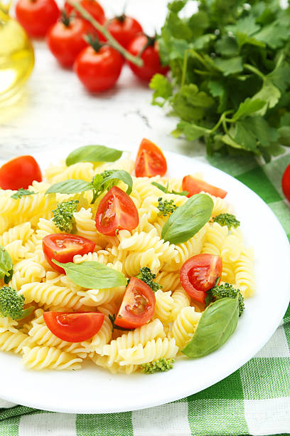 istock Delicious pasta on plate on white wooden background 513639268