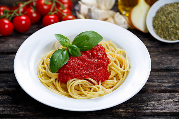 istock Spaghetti with marinara sauce and basil leaves on top. 513639892