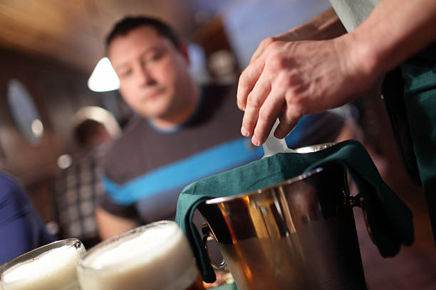 istock Waiter opens a bottle of vodka 513640002
