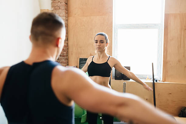 istock Personal trainer conduct warming-up for woman 513641158