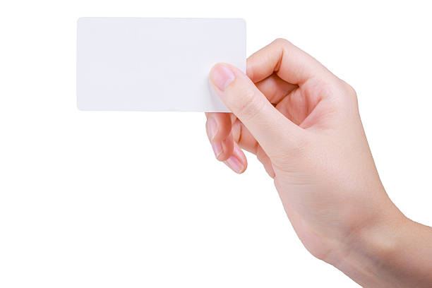 istock Business card in woman hand on white 513641400