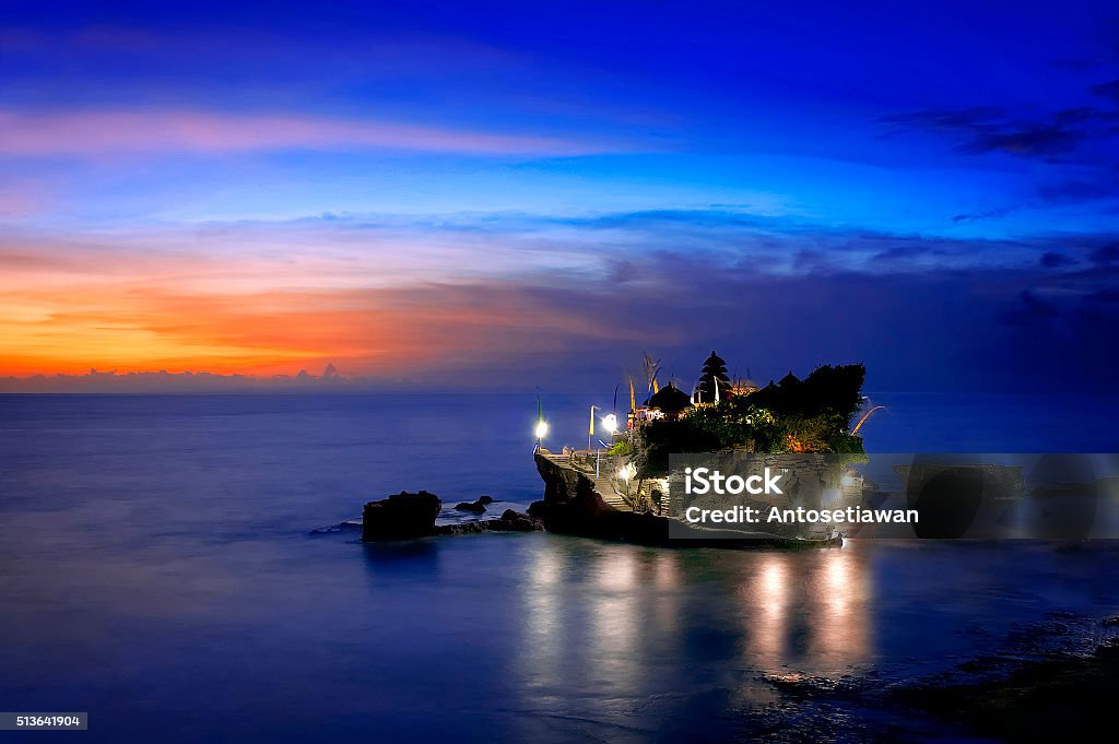 Balinese Temple In The Sunset A beautiful landscape of hinduism temple located in Tanah Lot Bali during yearly ritual Asia Stock Photo