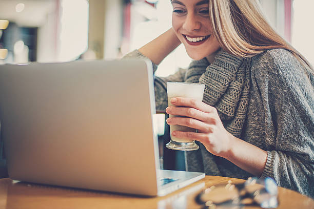 istock Woman with laptop and cappuccino 513642936
