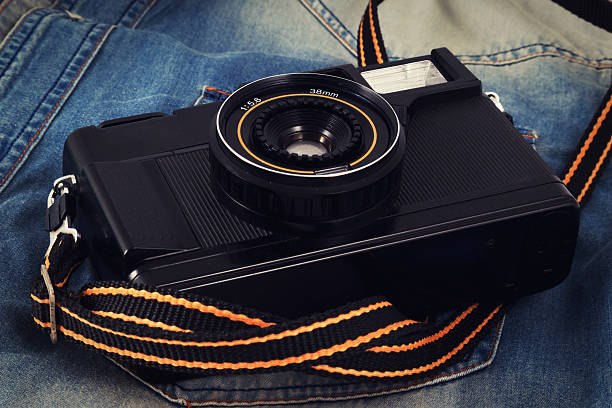 istock Old camera, vintage camera films popular in the past. 513643030