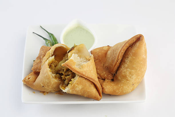 istock samosa with fresh mint dipping sauce , indian food 513644500