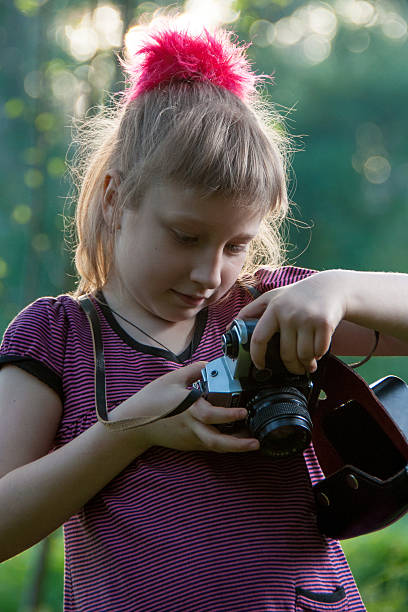 istock Girl with a camera in nature 513644696