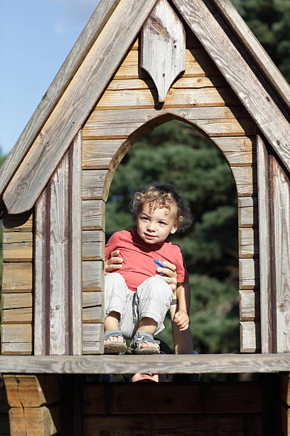 istock Child at wooden house 513645038