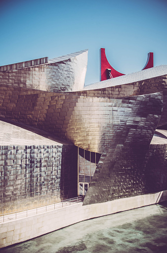 Bilbao, Spain - August 10, 2012: Guggenheim Museum Bilbao, designed by Canadian-American architect Frank Gehry, is one of the most admired works of contemporary architecture.
