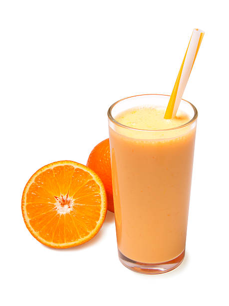 orange smoothie isolated stock photo