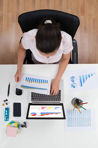 istock Businesswoman Working With Graphs 513645836